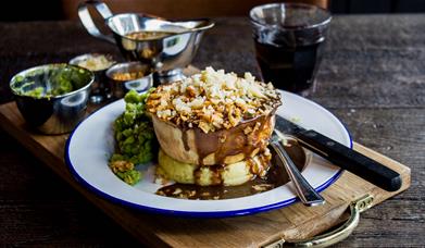 Pie on a plate with knife and fork