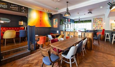 Tables and chairs inside The Cork