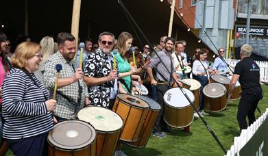 Team building group drumming