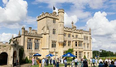 Exterior of Farleigh House, people gathered in the Garden