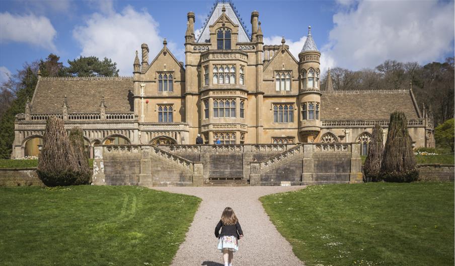 Girl playing in the garden at Easter at Tyntesfield, North Somerset by Rob Stothard