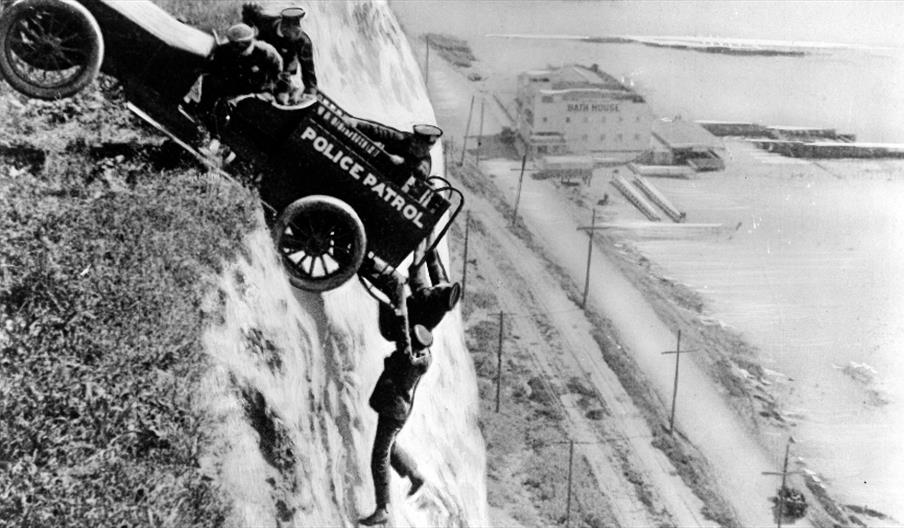 When Stunts go wrong - man holding onto a car, hanging off a cliff