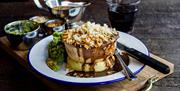 Pie on a plate with knife and fork