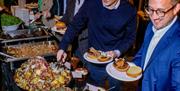 Event Guests plating up food