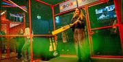 Women in batting cage