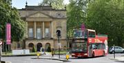 A Tootbus Bath open-top bus outside The Holburne Museum, Bath