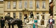 Horse and carriage outside or parade house