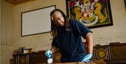 Bristol Waste Company cleaning services staff member cleaning a table.