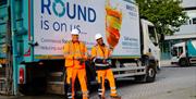 Bristol Waste Company waste management employees standing in front of their van.