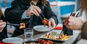 People eating with chopsticks