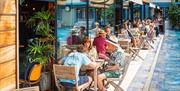 The Lido Restaurant people eating by the side of the pool